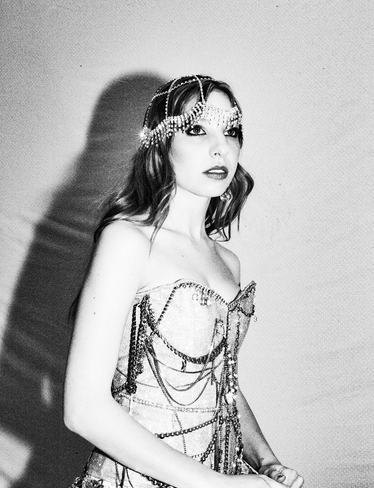 Black-and-white portrait of Tiffany Johnson in a jeweled chain headpiece and beaded bodice