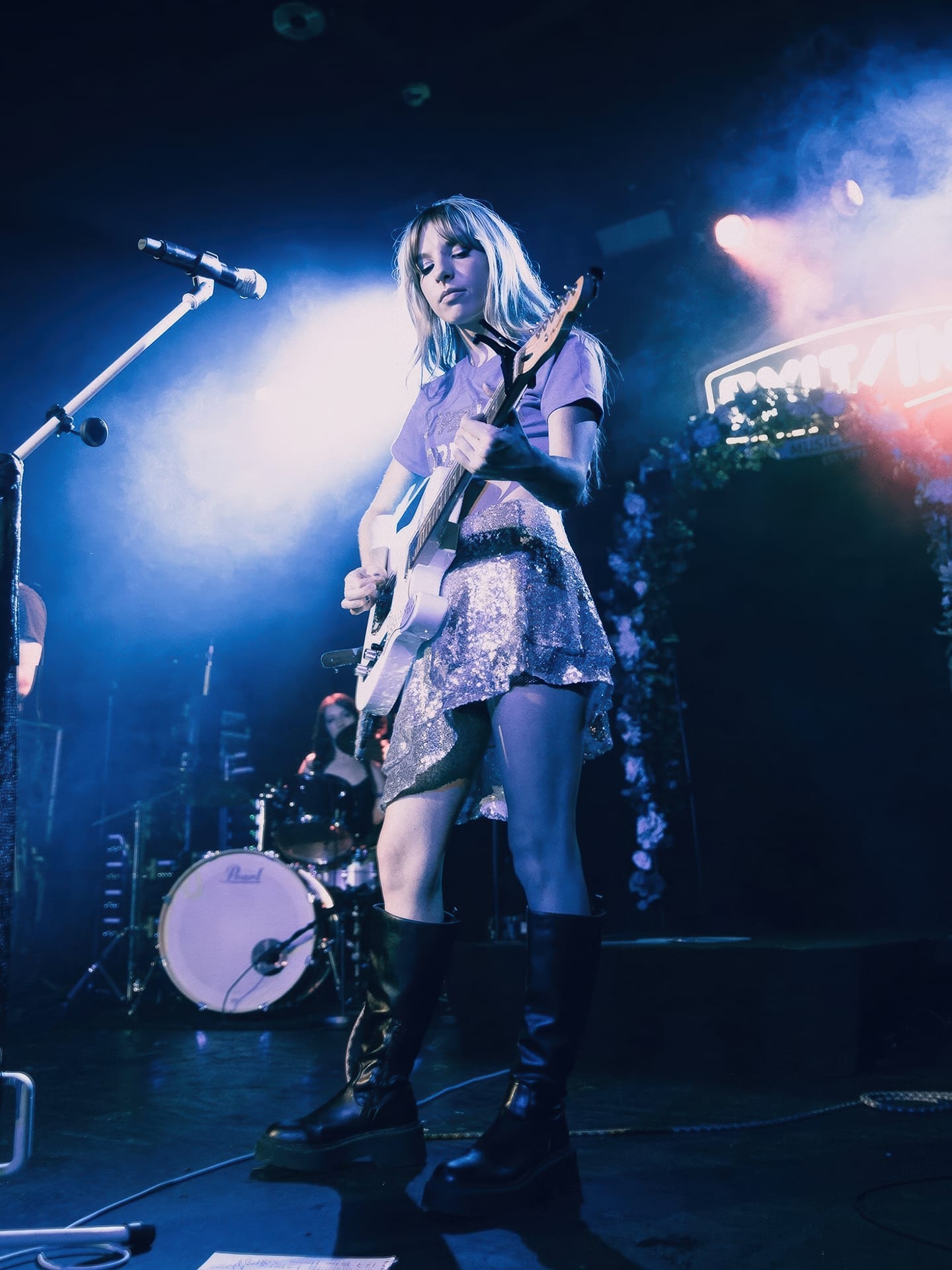Tiffany Johnson on stage at Exit/In, Nashville, with a white electric guitar